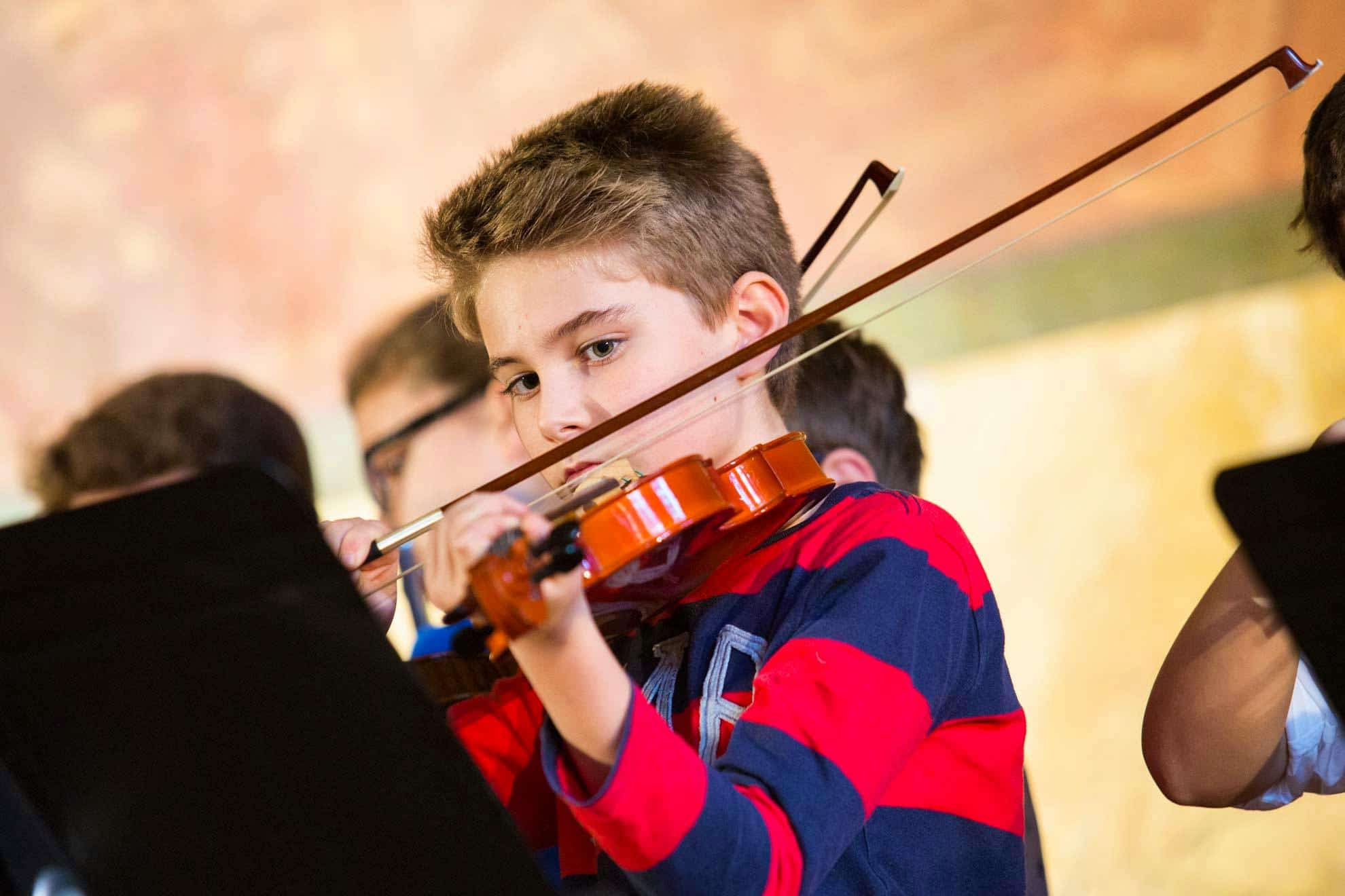 Young teenager plays violin